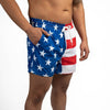 Person wearing American flag patterned swim shorts on a white background