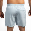 Light blue shorts worn by a person on a white background