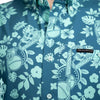 Blue shirt with skull and flower pattern, Grunt Style label visible