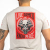 Person wearing a t-shirt with 'Live Armed, Know Peace' graphic on the back