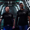 Two men wearing black 'FAFO' t-shirts standing in a futuristic setting.