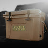 Beige cooler with 'Over Taxed' text on a blurred background