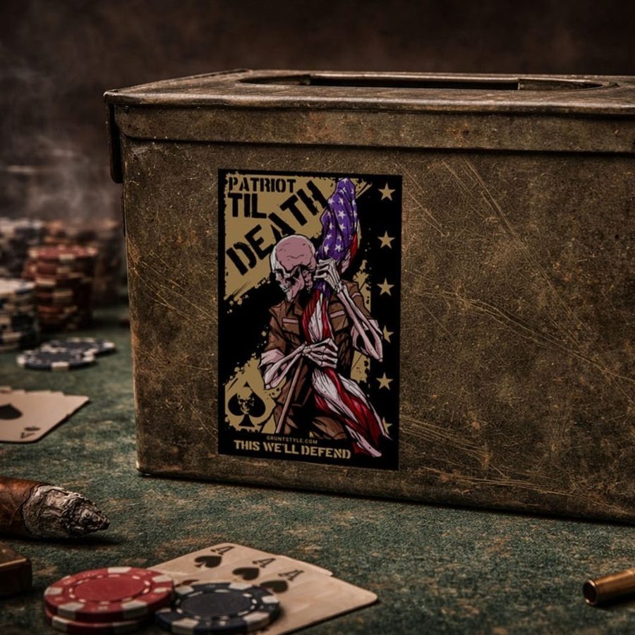 Vintage ammunition box with a graphic design on a table with poker chips and cards.
