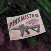 Sticker with 'Pinkmister' and a gun illustration on a textured background