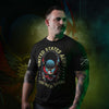Man wearing a black t-shirt with military-themed graphics and text.