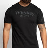 Black t-shirt with 'Whiskey HELPS' text worn by a person on a light gray background