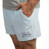 Light blue shorts with branding on a white background