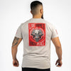 Man wearing a t-shirt with a graphic design on the back featuring text and a skull.