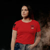 Woman wearing a red t-shirt with a logo on a dark background
