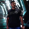 Man wearing a black t-shirt with 'FAFO' logo in a futuristic setting