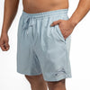 Light blue shorts worn by a person on a white background
