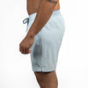 Light blue swim shorts with a brand logo on a white background