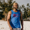 Man wearing a blue tank top with a red graphic on a beach