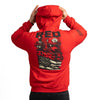 Red hoodie with graphic design on the back, worn by a person against a white background