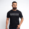 Man wearing a black t-shirt with 'DEFEND THE CHILDREN' text on a white background