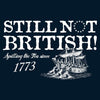 Navy blue t-shirt with white text and ship graphic, featuring the phrase 'Still Not British! Spilling the Tea since 1773'.
