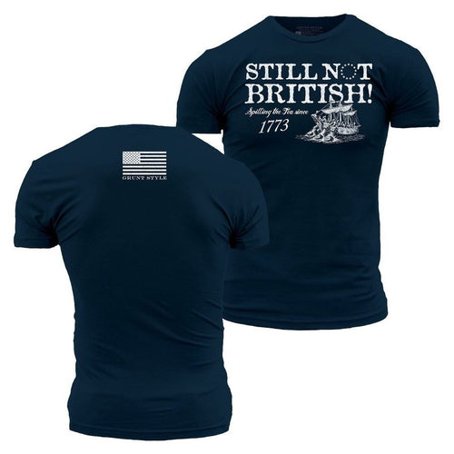 Navy blue t-shirt with 'Still Not British!' text and American flag on front, and graphic design on back.
