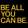 Motivational quote 'BE ALL YOU CAN BE.' in yellow on a black background