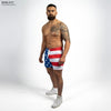Man wearing American flag swim shorts on a white background